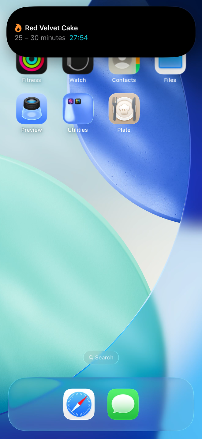A cooking timer Live Activity for Plate expanded in the iPhone Dynamic Island.
